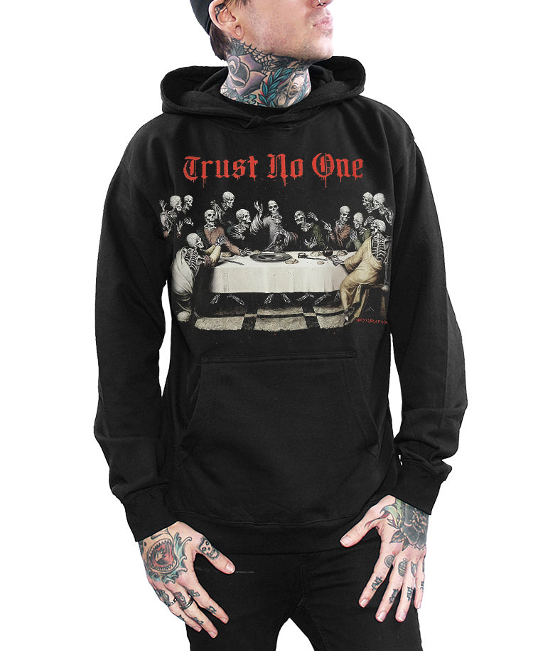Black hoodie with graphic design and 'Trust No One' text worn by a person on a white background