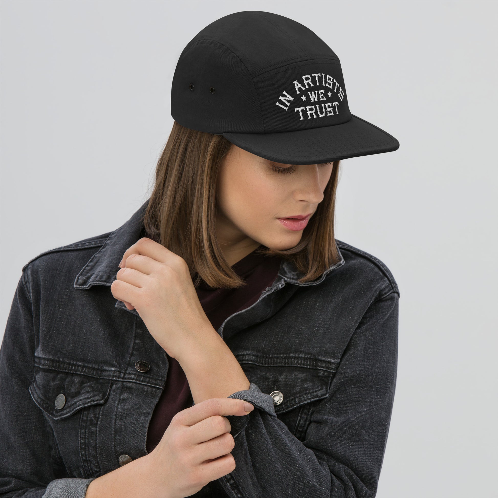 model wearing in artists we trust hat