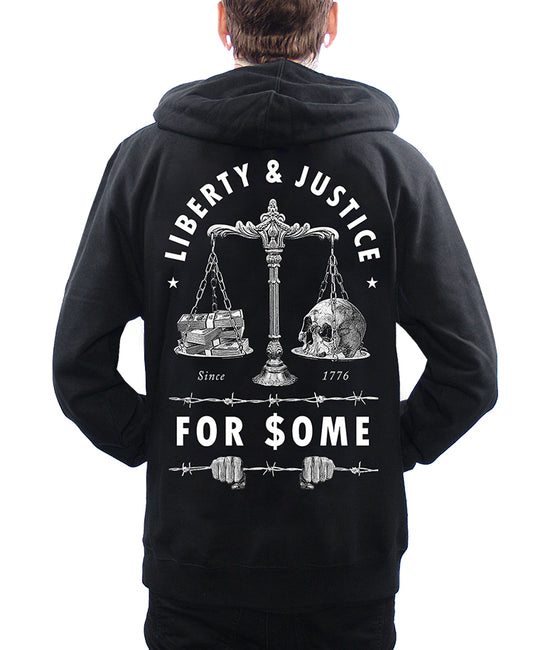 model wearing hoodie with liberty and justice for some money and skull and justice scales