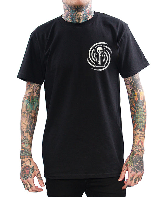 model wearing shirt with skeleton key design on chest