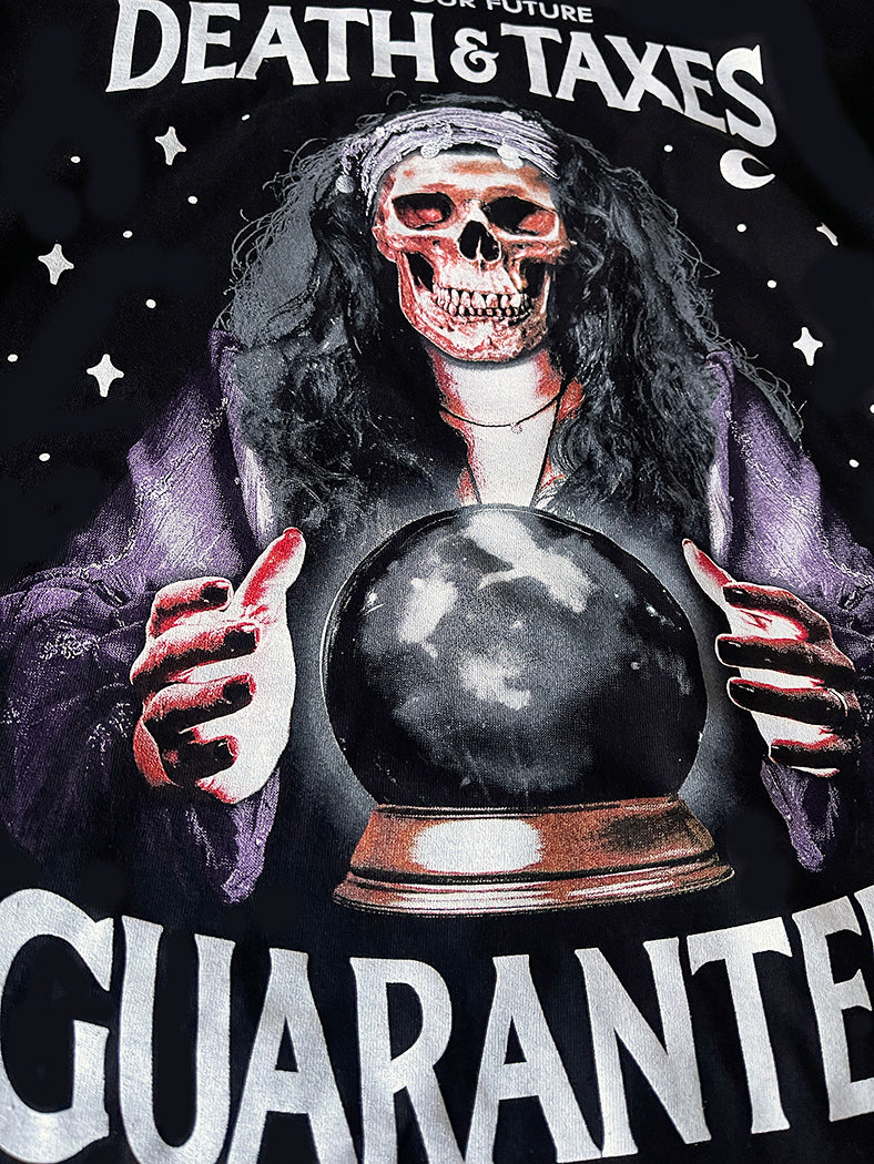 psychic with skull and crystal ball with I see your future death & taxes guaranteed