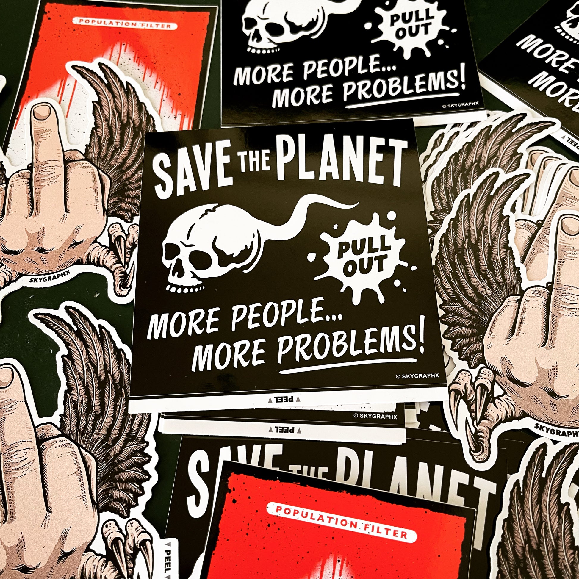 collection of save the planet, flying fucks and population filter stickers on a table