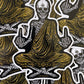 Pattern of a skeleton in a meditative pose with hands in a peace sign, on a dark background.