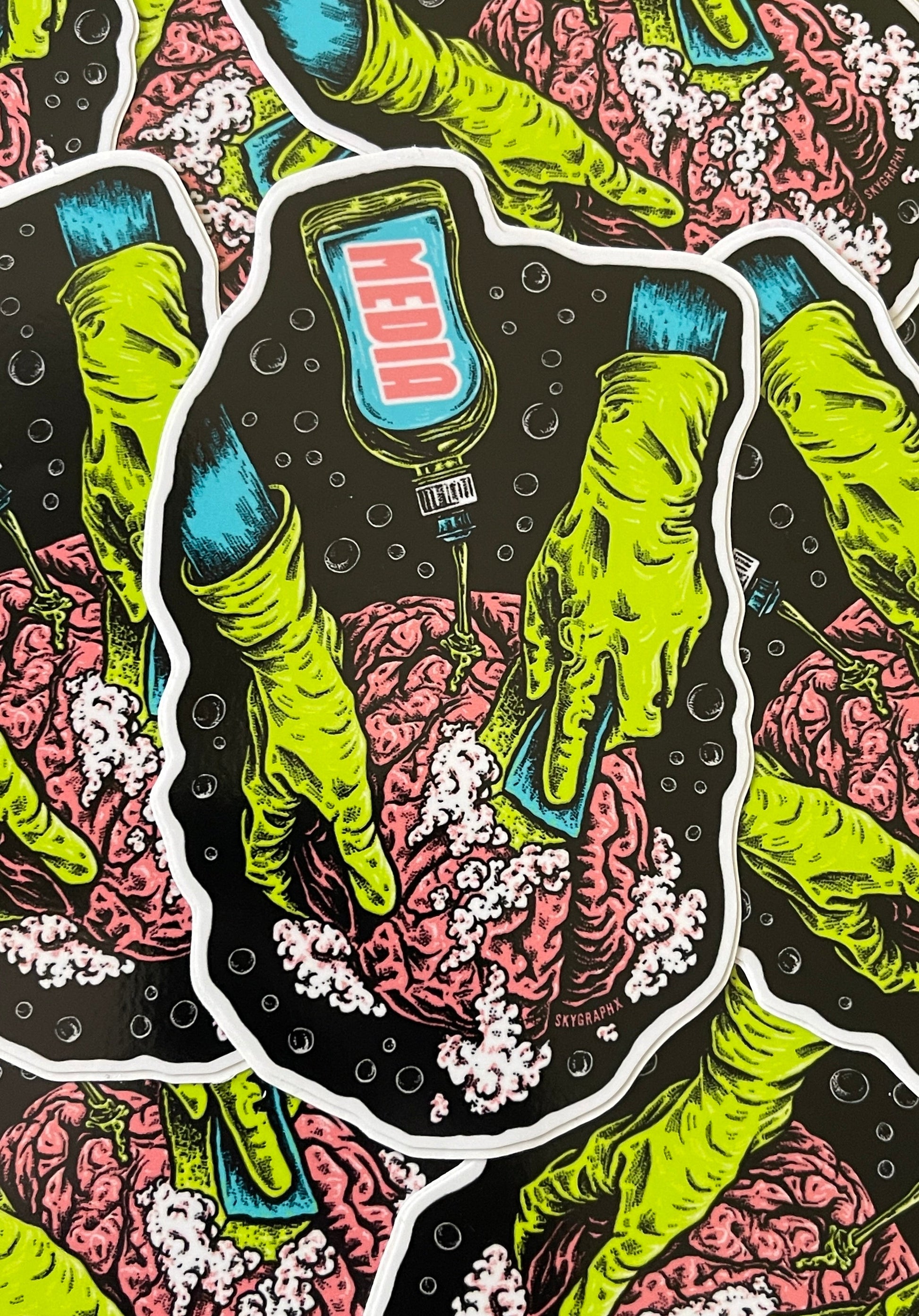 Sticker design with green hands holding a bottle labeled 'Medio' against a black background with white bubbles.