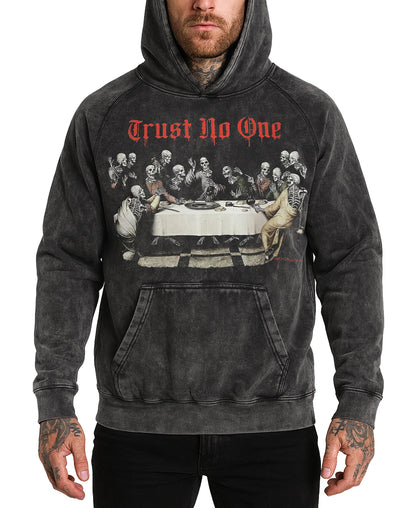 Person wearing a hoodie with a graphic design and text 'Trust No One' on a white background
