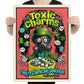 Person holding a poster with a colorful design featuring a character in a gas mask and text about 'Toxic Charms'.