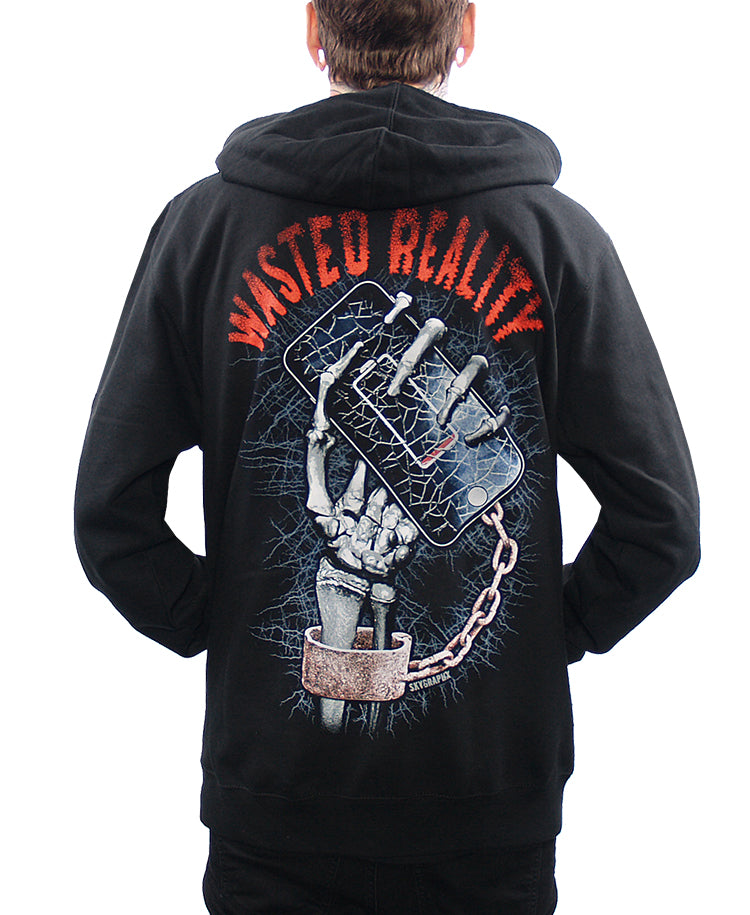 back view of model wearing hoodie with skeleton hand holding cell phone says wasted reality